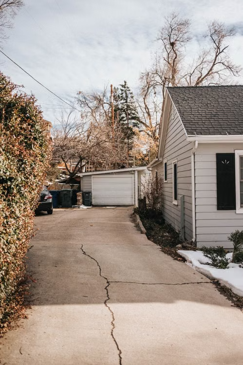 Suburban home with driveway and a garage.