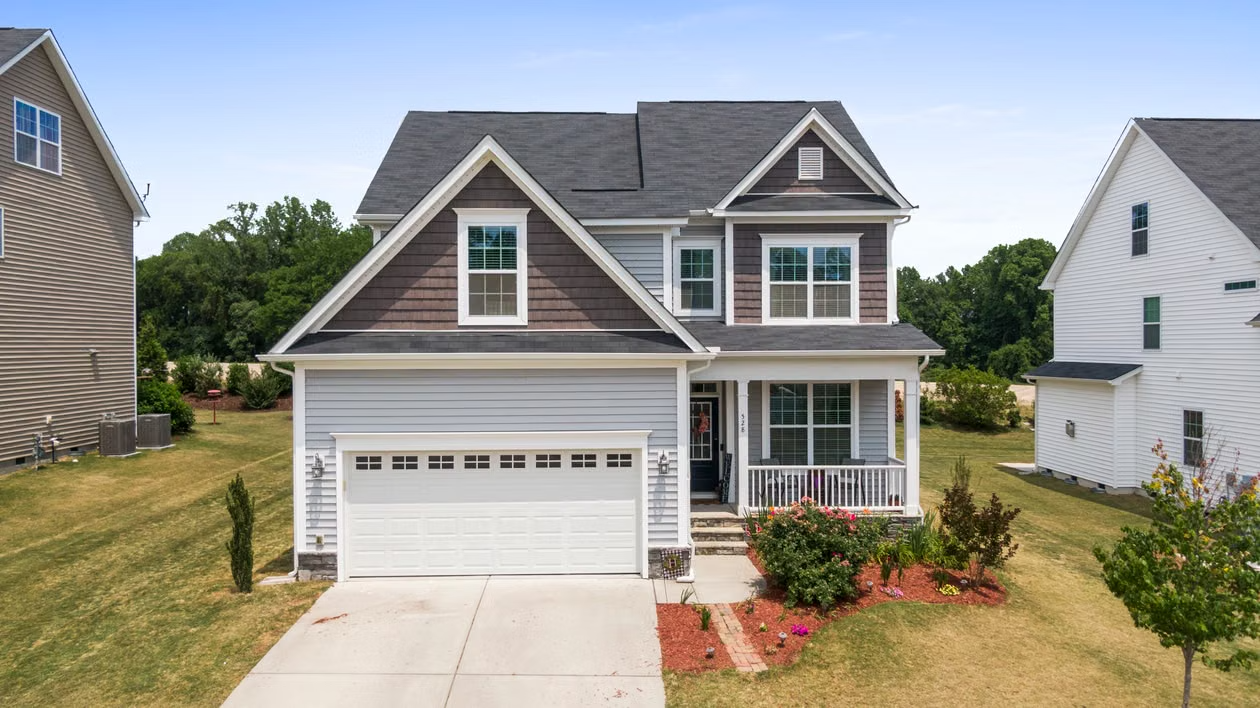 Modern home with a garage door representing routine garage door maintenance and professional opener inspection.